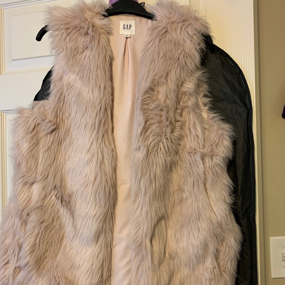 Light pink faux fur vest.